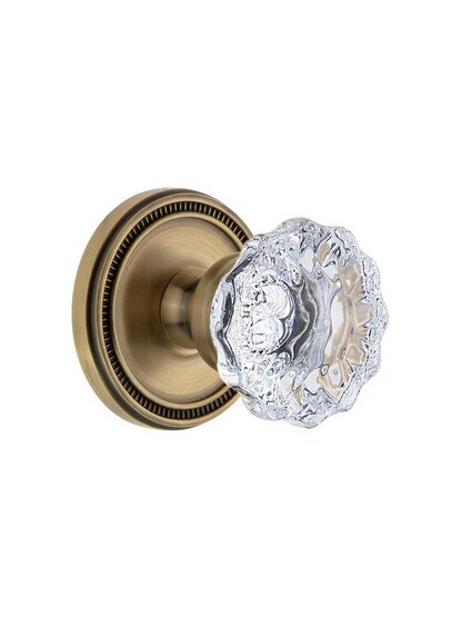 Grandeur Soleil Rosette Door Set with Fontainebleau Crystal-Glass Knobs in Antique Brass.